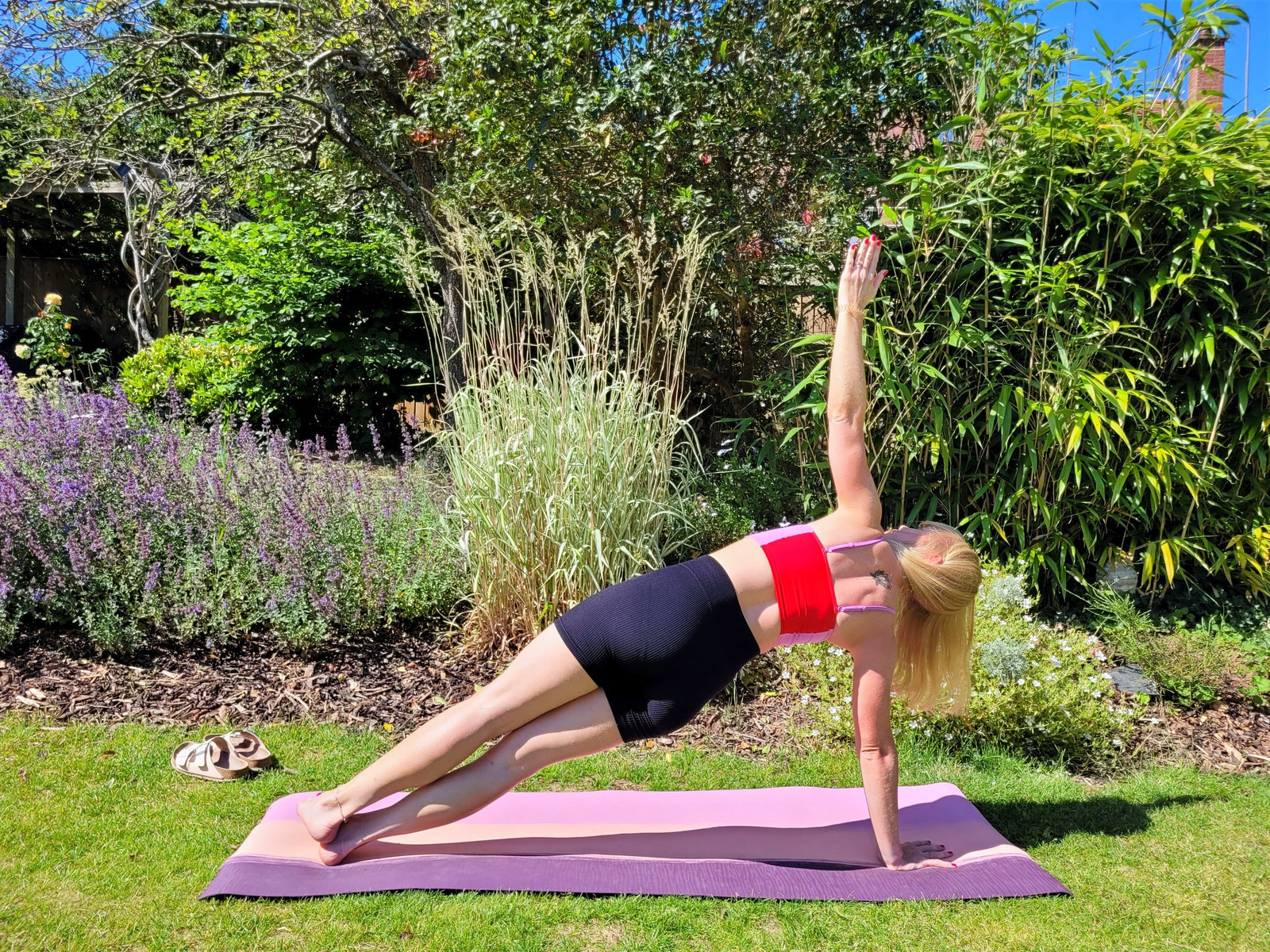 Side plank pose demonstrated as a core-strengthening yoga pose for runners